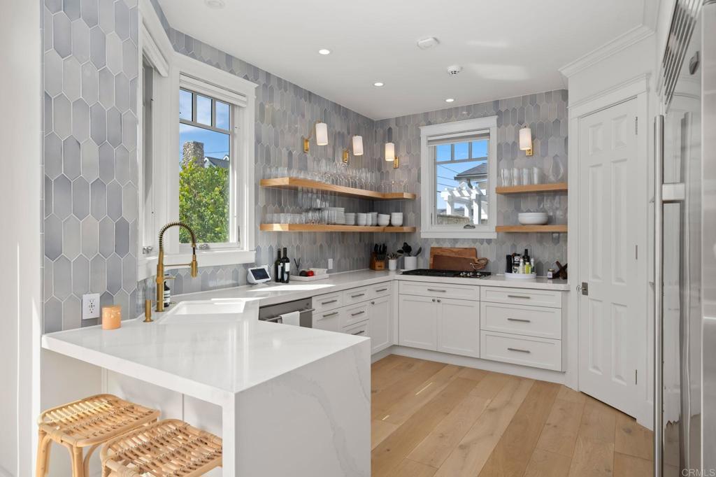 2211 Ocean Front Del Mar, CA 92014 - Photo 4 of 13 a kitchen with sink cabinets and window
