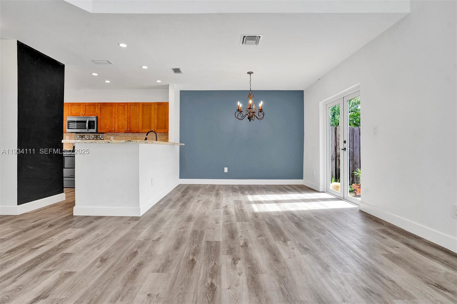 20985 Southwest 84th Avenue Cutler Bay, FL 33189 - Photo 12 of 36 a view of empty room with wooden floor