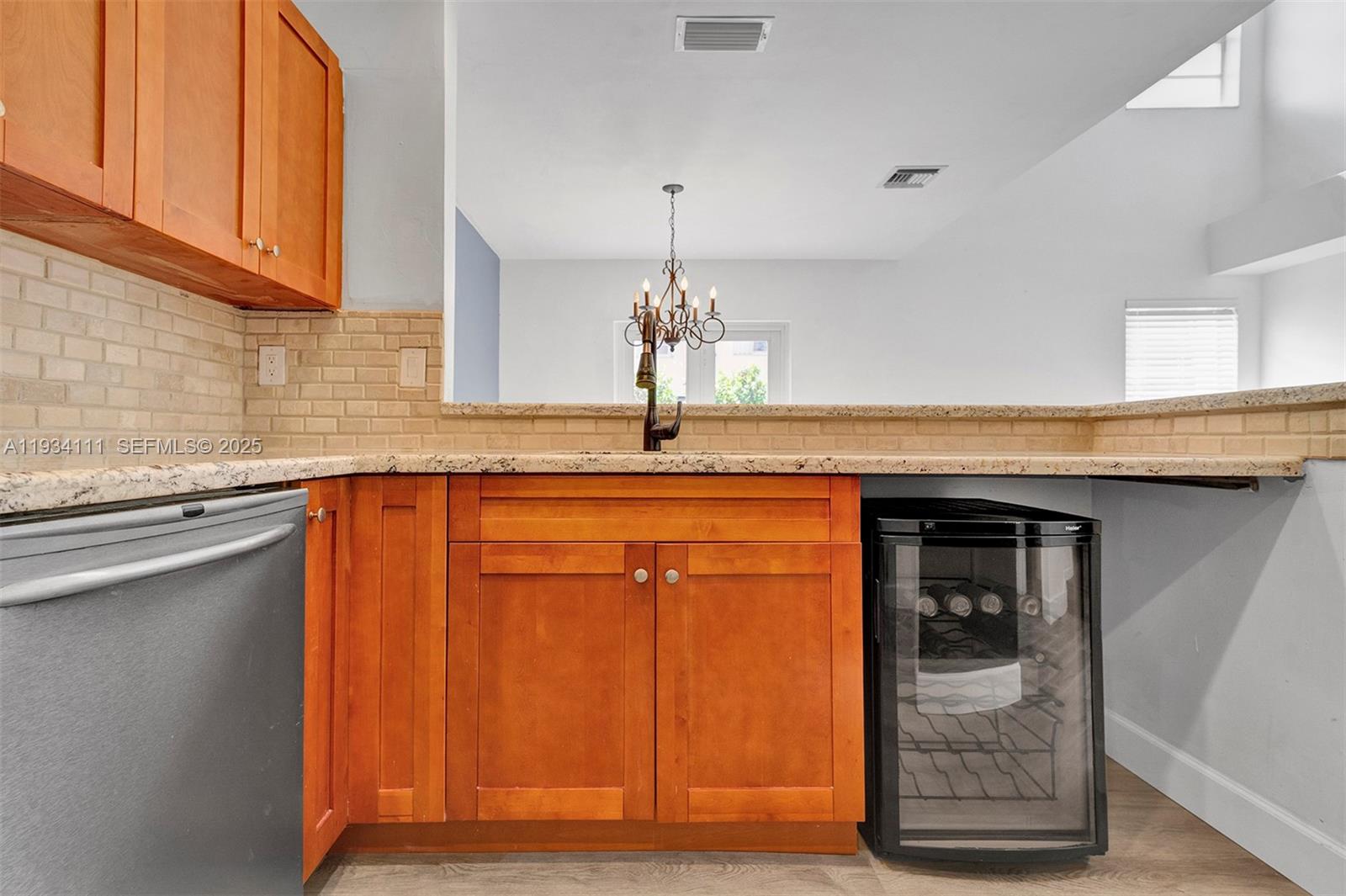 20985 Southwest 84th Avenue Cutler Bay, FL 33189 - Photo 15 of 36 a kitchen with granite countertop cabinets and wooden floor