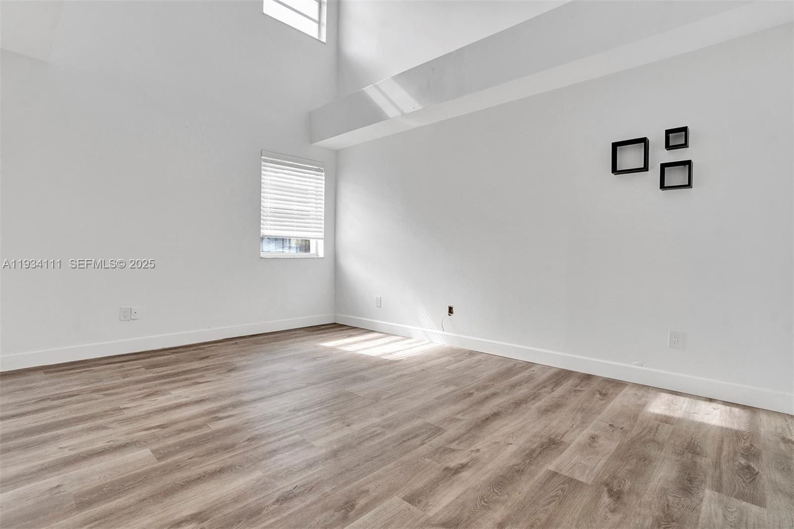 20985 Southwest 84th Avenue Cutler Bay, FL 33189 - Photo 18 of 36 wooden floor in an empty room
