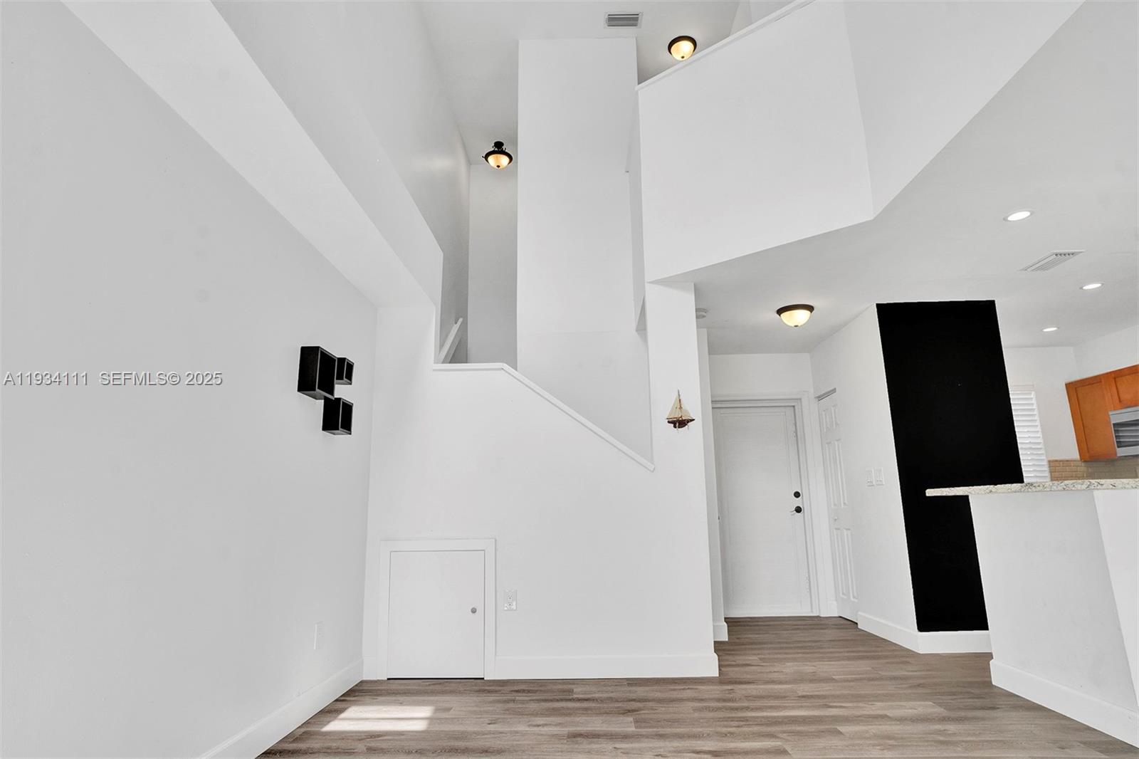 20985 Southwest 84th Avenue Cutler Bay, FL 33189 - Photo 22 of 36 a view of entryway with wooden floor