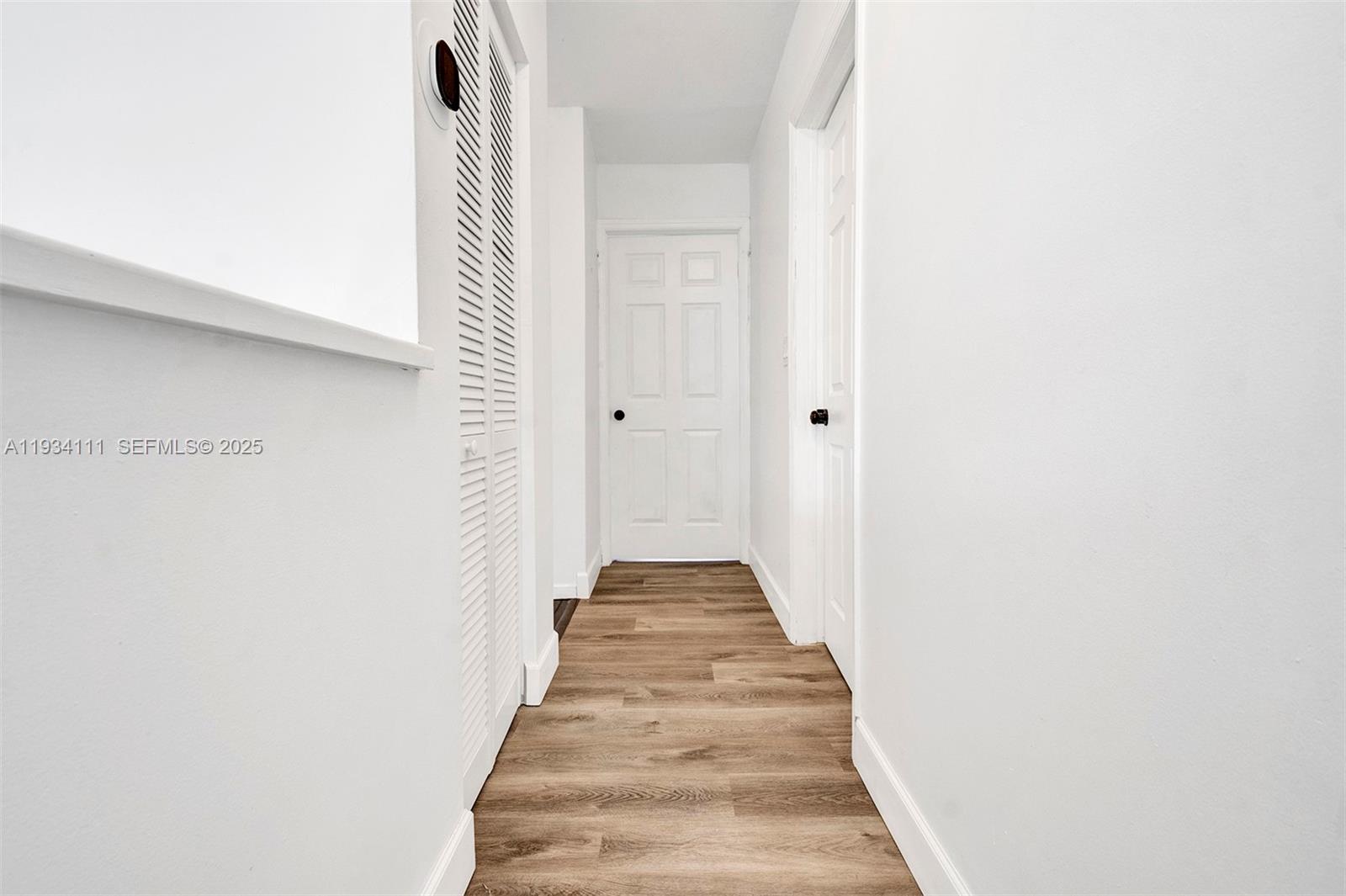 20985 Southwest 84th Avenue Cutler Bay, FL 33189 - Photo 23 of 36 a view of a hallway with wooden floor and staircase