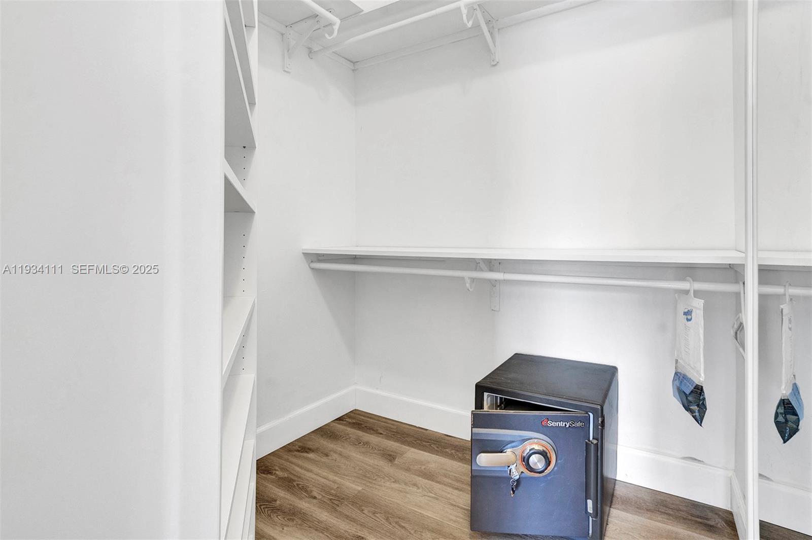 20985 Southwest 84th Avenue Cutler Bay, FL 33189 - Photo 30 of 36 a view of storage and utility room with wooden floor