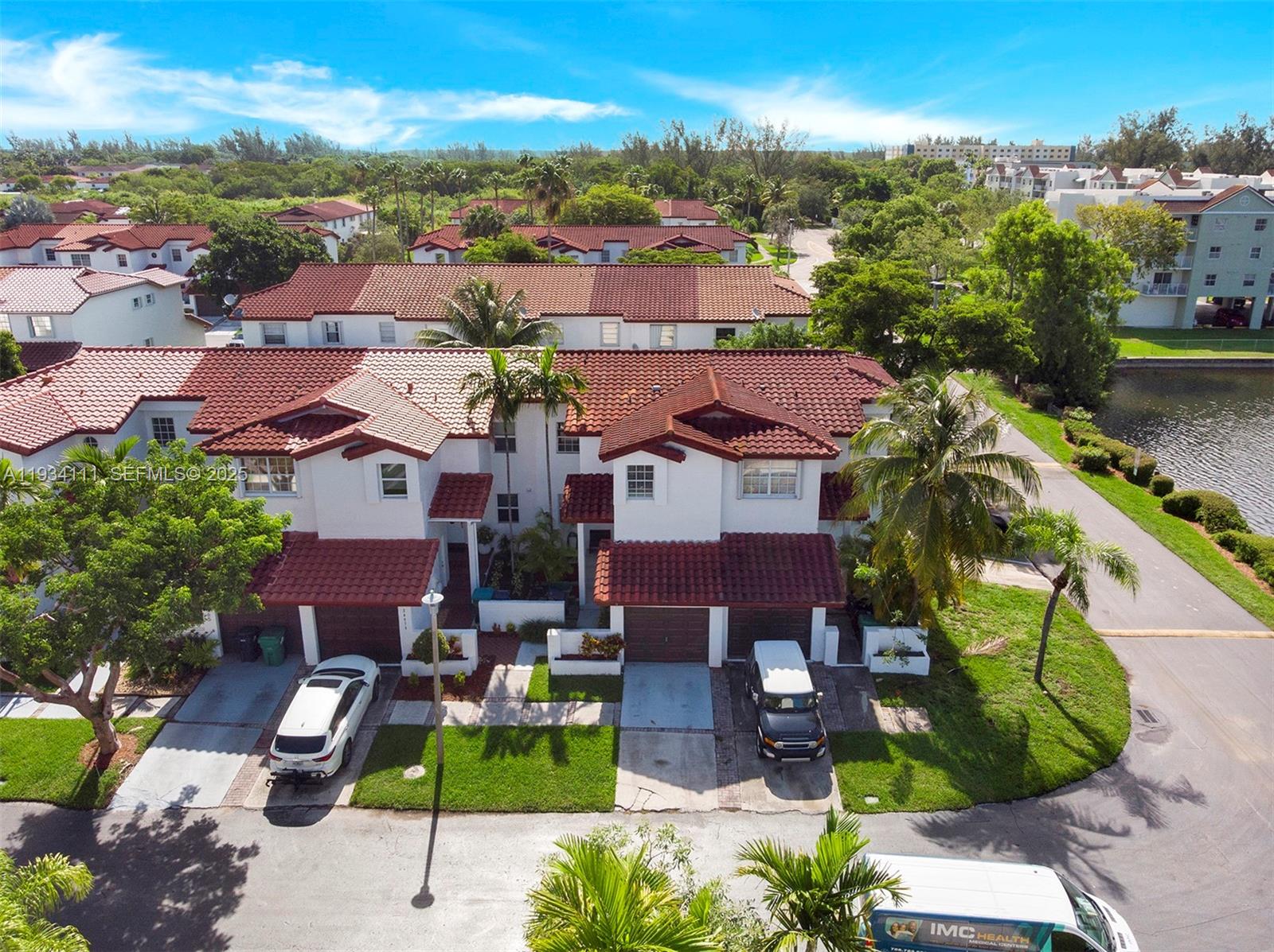 20985 Southwest 84th Avenue Cutler Bay, FL 33189 - Photo 6 of 36 an aerial view of multiple houses with yard
