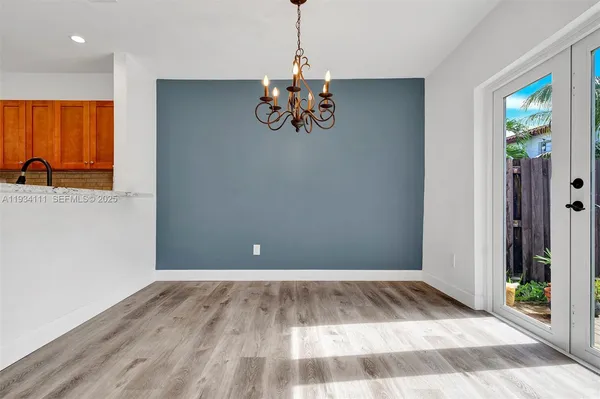 a view of a livingroom with wooden floor