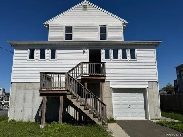 a front view of a house with yard