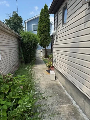 a view of a patio with chair and tables