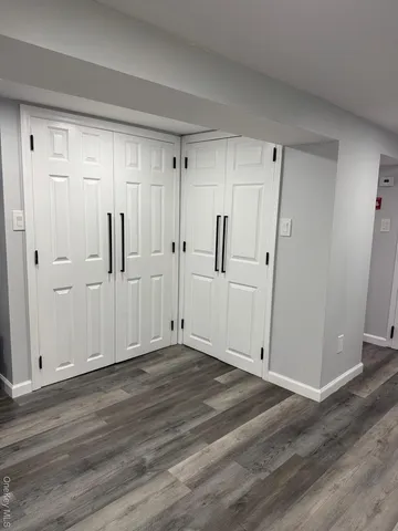 a room with storage and a utility room