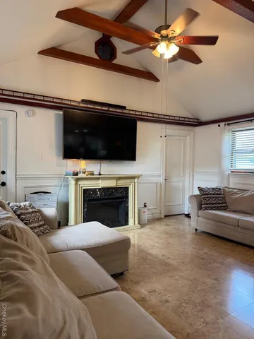 a view of a livingroom with furniture and a fireplace