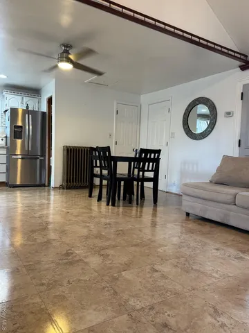 a view of dining room with furniture and chandelier