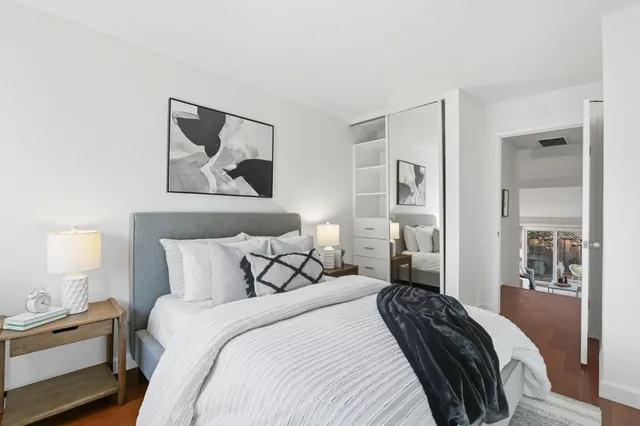 a bedroom with a bed and lamp