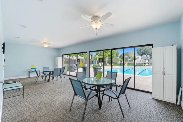 a view of a dining room with furniture window and outside view