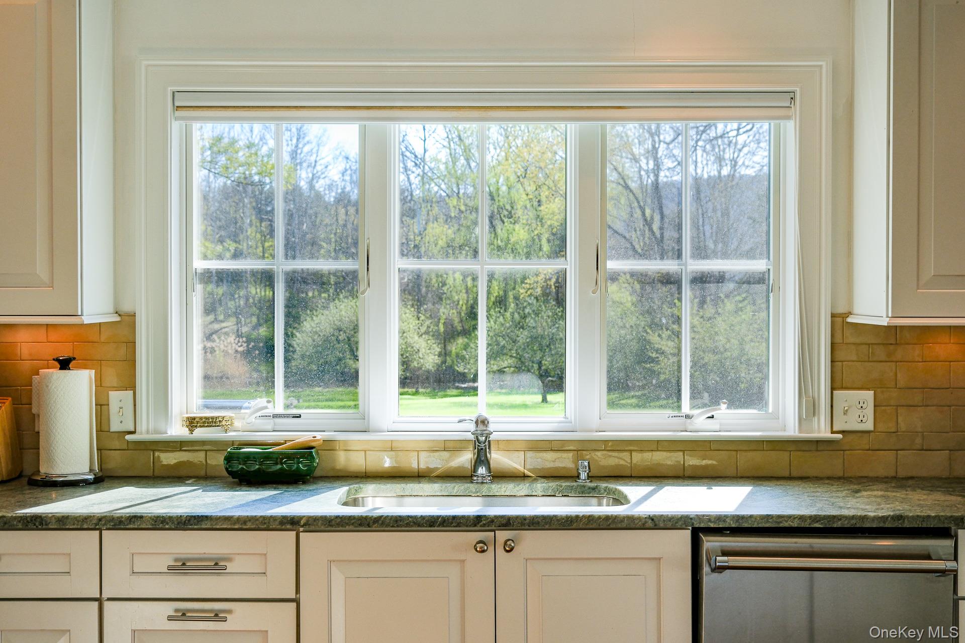 151 Benson Hill Road Wassaic, NY 12592 - Photo 17 of 45 a kitchen with granite countertop a sink and a window