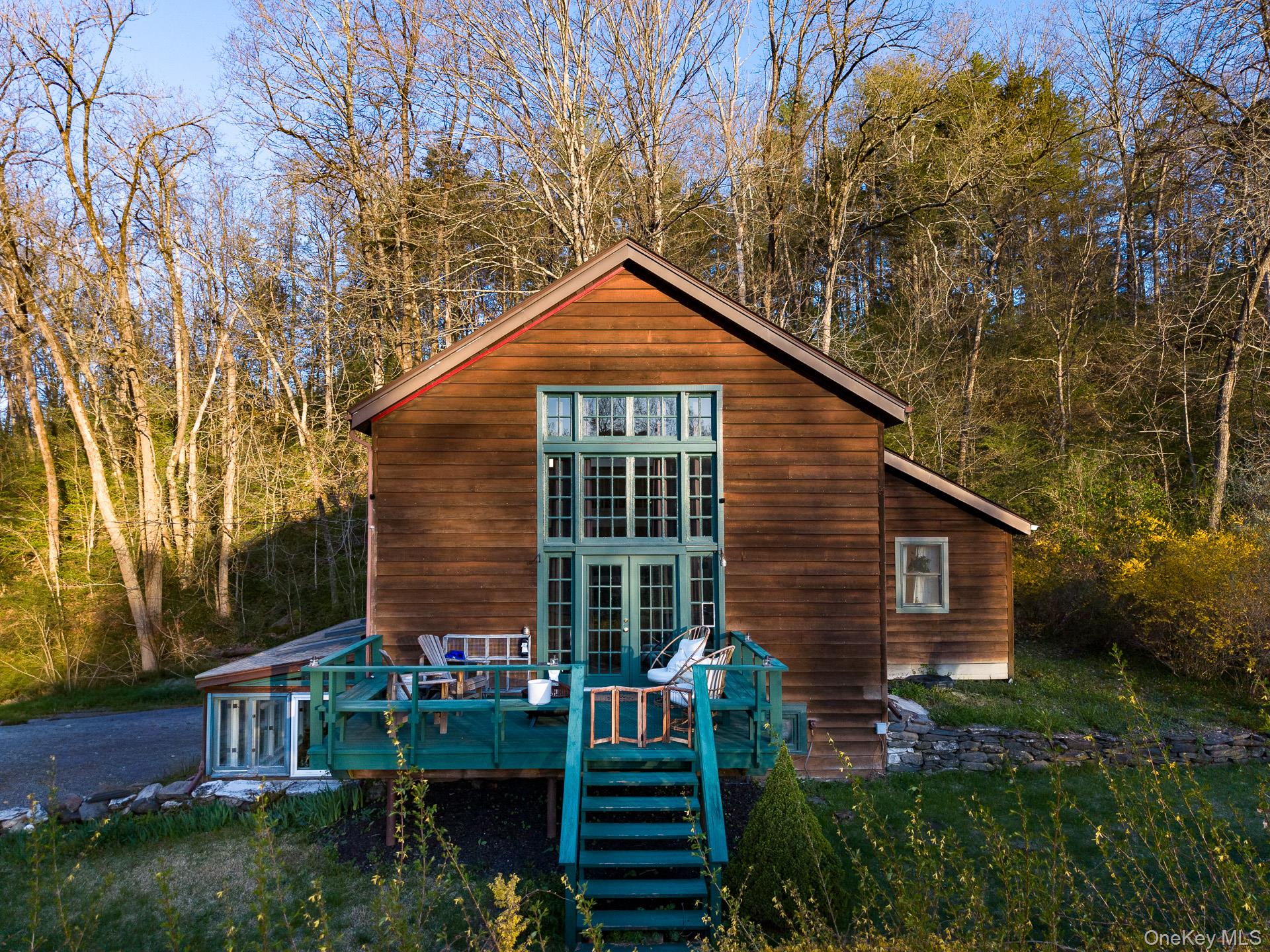 151 Benson Hill Road Wassaic, NY 12592 - Photo 27 of 45 a backyard of a house with plants and tree