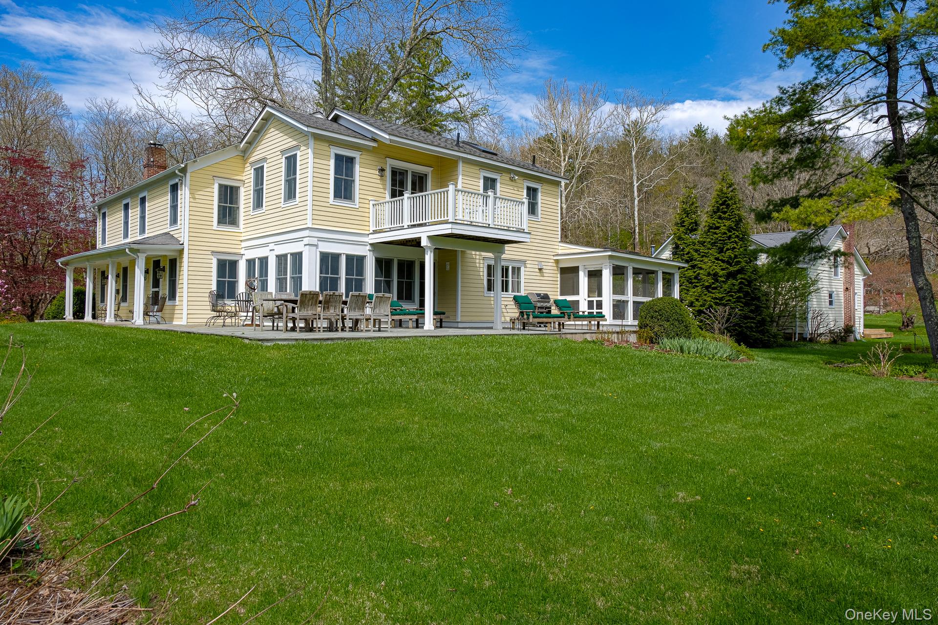 151 Benson Hill Road Wassaic, NY 12592 - Photo 40 of 45 a front view of a house with garden and trees