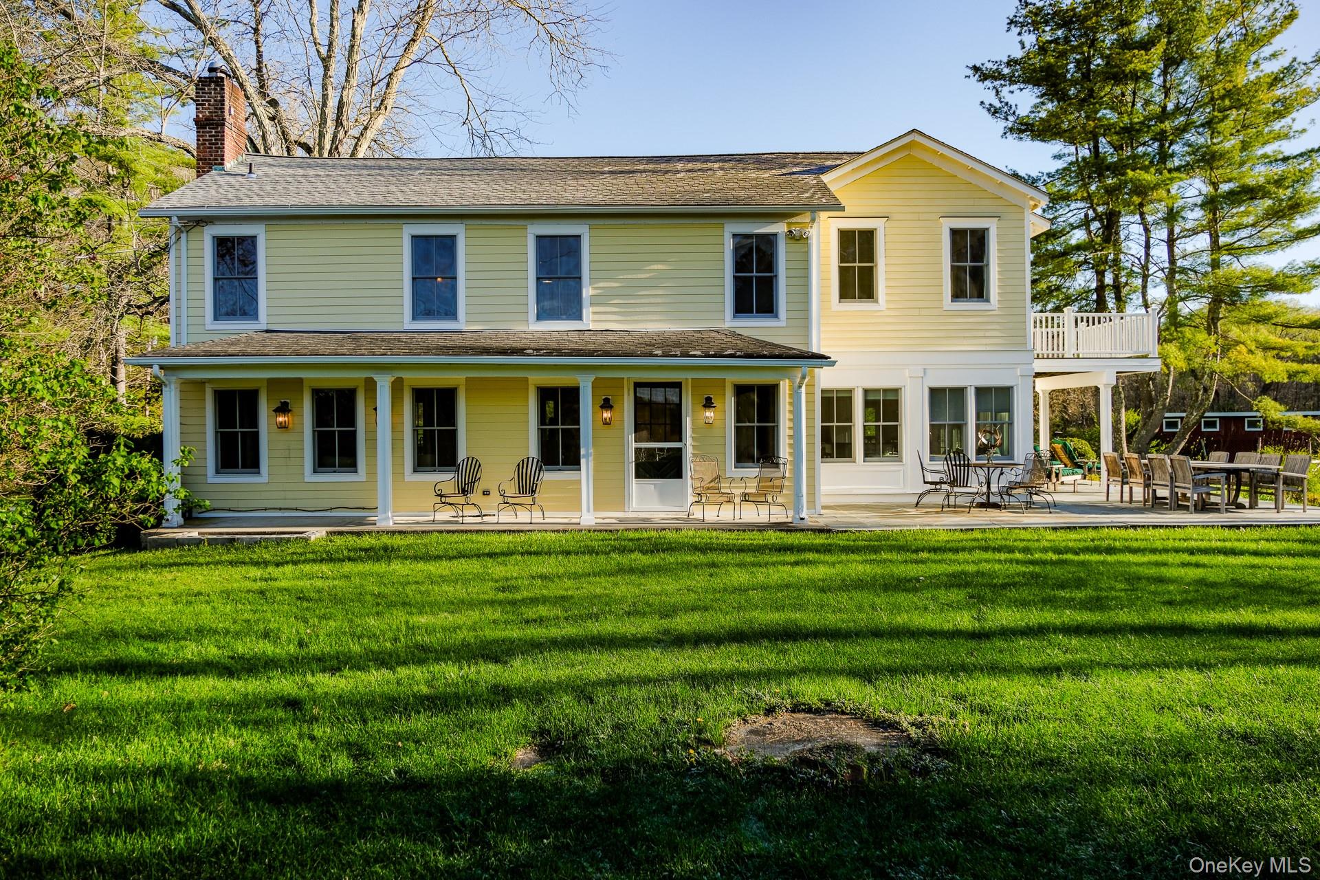 151 Benson Hill Road Wassaic, NY 12592 - Photo 8 of 45 a front view of a house with a garden