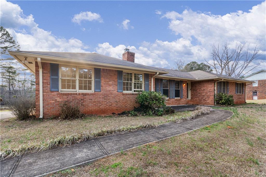 7085 Hobgood Road Fairburn, GA 30213 - Photo 1 of 40 a view of a yard in front of a house