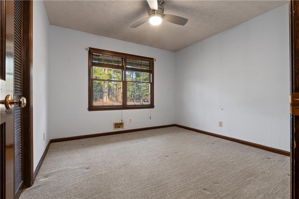 7085 Hobgood Road Fairburn, GA 30213 - Photo 15 of 40 an empty room with a window