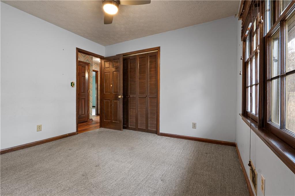 7085 Hobgood Road Fairburn, GA 30213 - Photo 16 of 40 a view of an empty room with a window