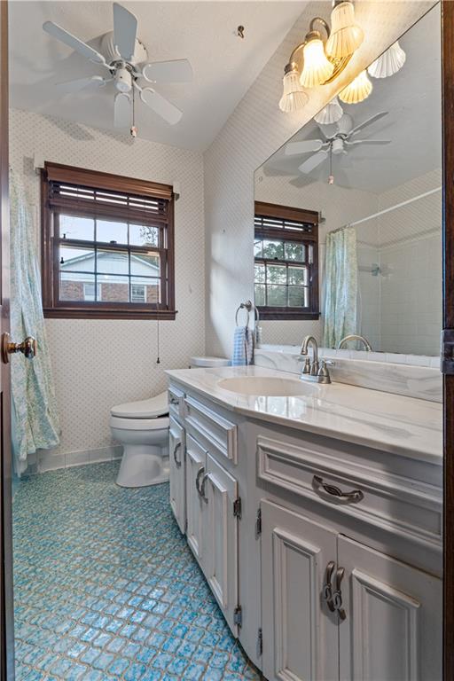 7085 Hobgood Road Fairburn, GA 30213 - Photo 22 of 40 a bathroom with a granite countertop sink a toilet a mirror and shower