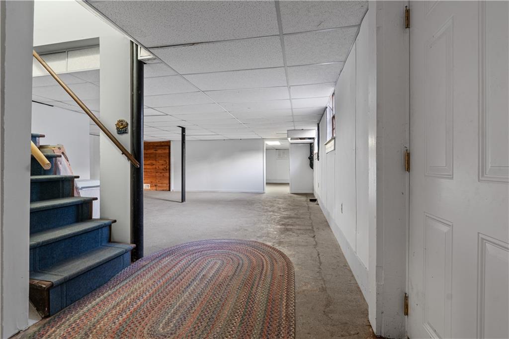 7085 Hobgood Road Fairburn, GA 30213 - Photo 28 of 40 a view of hallway with stairs and wooden floor