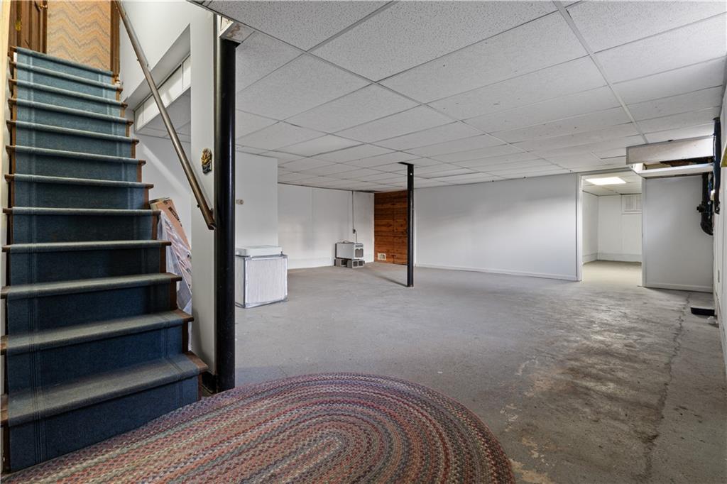 7085 Hobgood Road Fairburn, GA 30213 - Photo 29 of 40 a view of empty room with wooden floor and fan