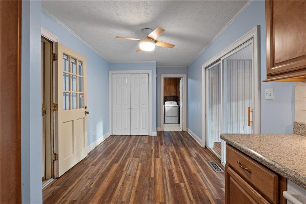 7085 Hobgood Road Fairburn, GA 30213 - Photo 7 of 40 a view of a kitchen from the hallway