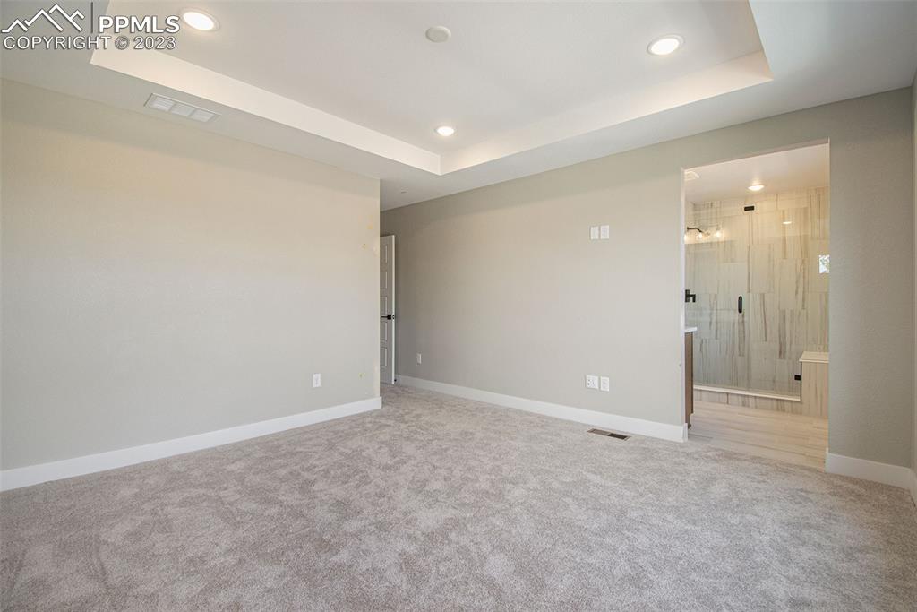 1968 Peridot Loop Heights Colorado Springs, CO 80908 - Photo 3 of 10 an empty room with an entryway