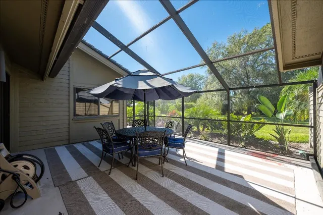 a view of a two chairs in the balcony