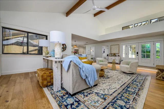 a living room with lots of furniture and a rug