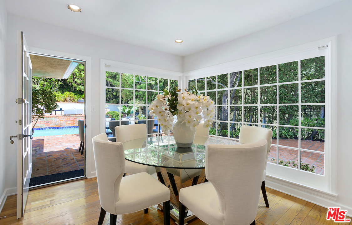 1124 Laurel Way Beverly Hills, CA 90210 - Photo 13 of 31 a living room with furniture and a large window