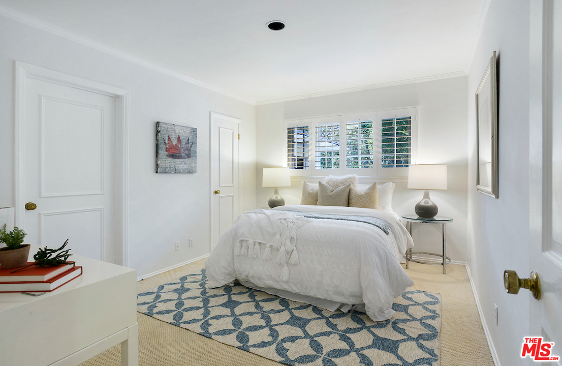 1124 Laurel Way Beverly Hills, CA 90210 - Photo 15 of 31 a bedroom with a bed and a window