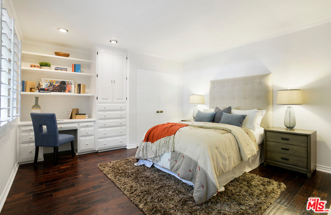 1124 Laurel Way Beverly Hills, CA 90210 - Photo 16 of 31 a bed room with a bed and a chair