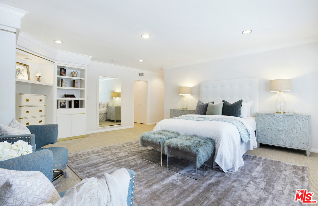 1124 Laurel Way Beverly Hills, CA 90210 - Photo 17 of 31 a spacious bedroom with a bed and a window