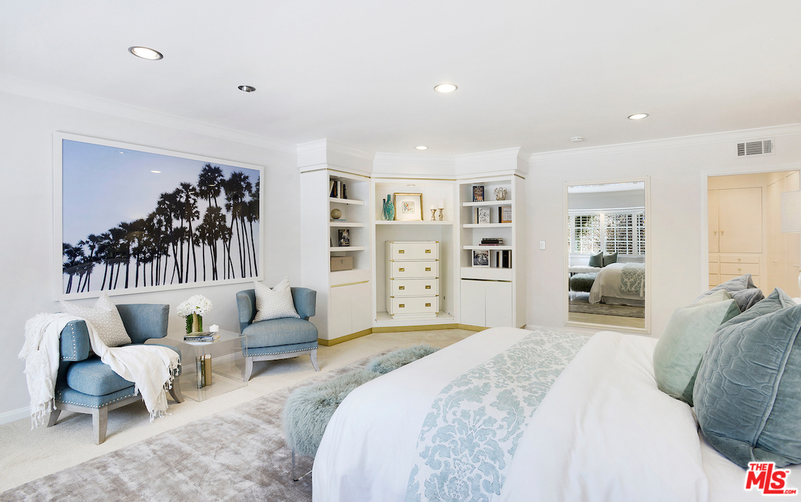 1124 Laurel Way Beverly Hills, CA 90210 - Photo 18 of 31 a spacious bedroom with a large bed and a couch