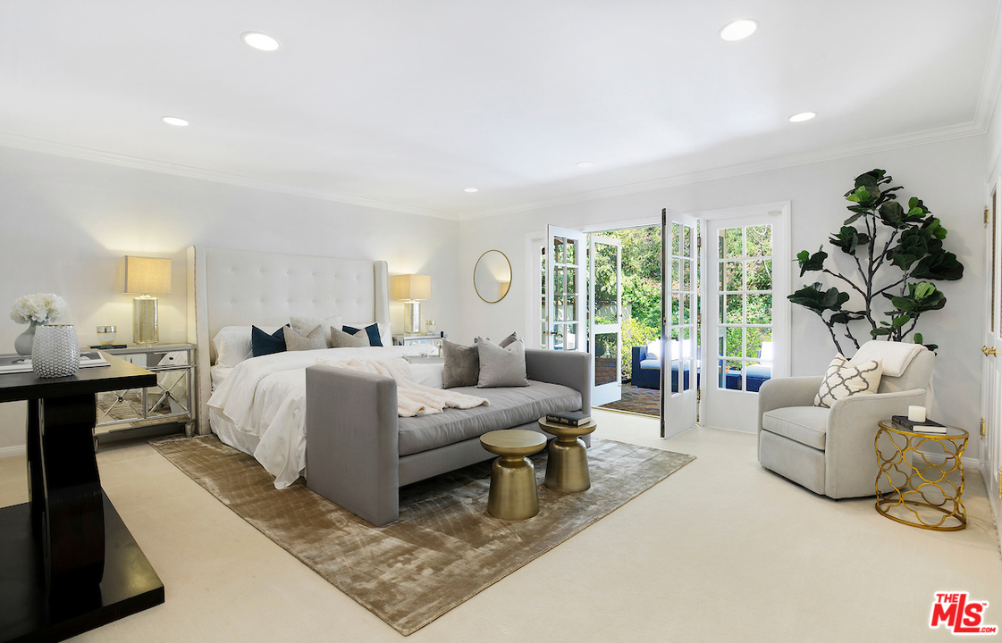 1124 Laurel Way Beverly Hills, CA 90210 - Photo 20 of 31 a living room with furniture and a large window