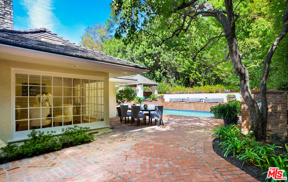 1124 Laurel Way Beverly Hills, CA 90210 - Photo 24 of 31 a view of house with backyard and outdoor seating