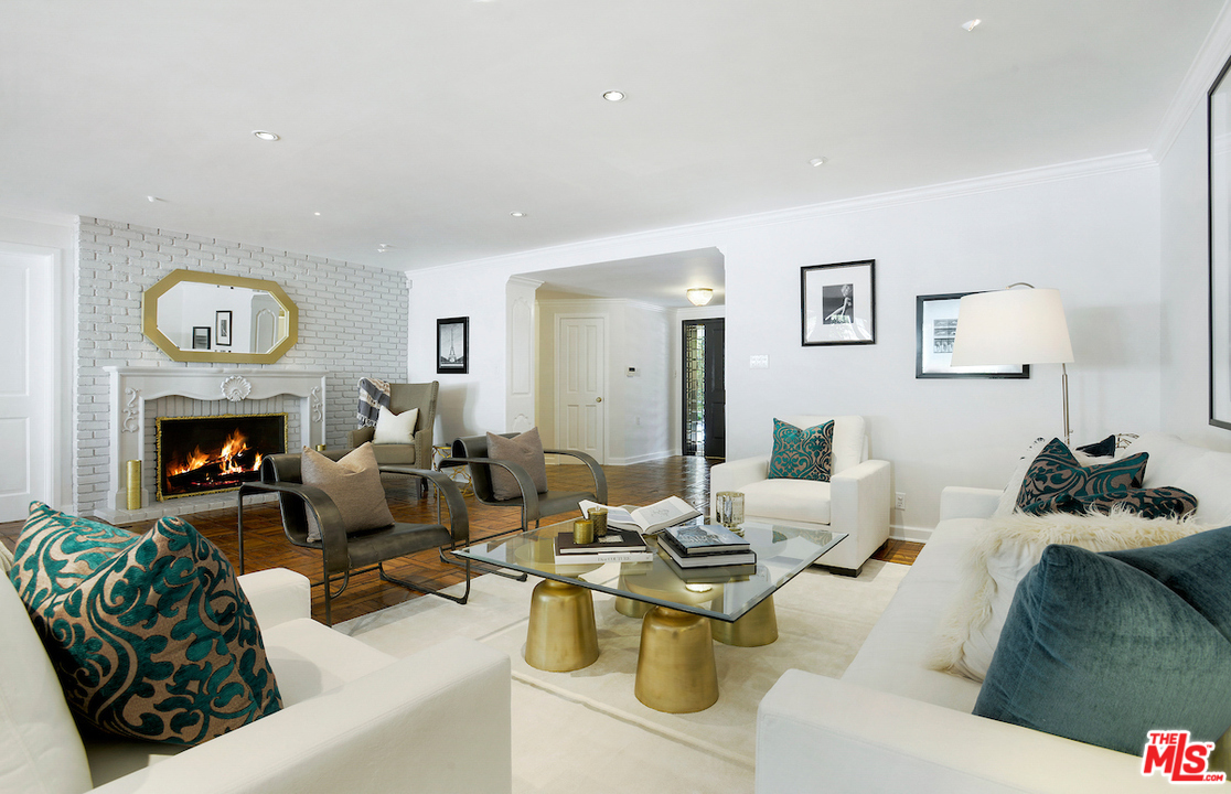 1124 Laurel Way Beverly Hills, CA 90210 - Photo 6 of 31 a living room with furniture and a fireplace