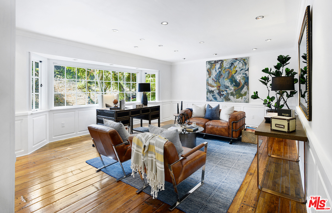 1124 Laurel Way Beverly Hills, CA 90210 - Photo 10 of 31 a living room with furniture and a large window