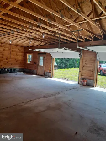 a view of a room with wooden walls
