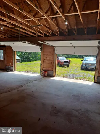 a view of an empty room with a garage
