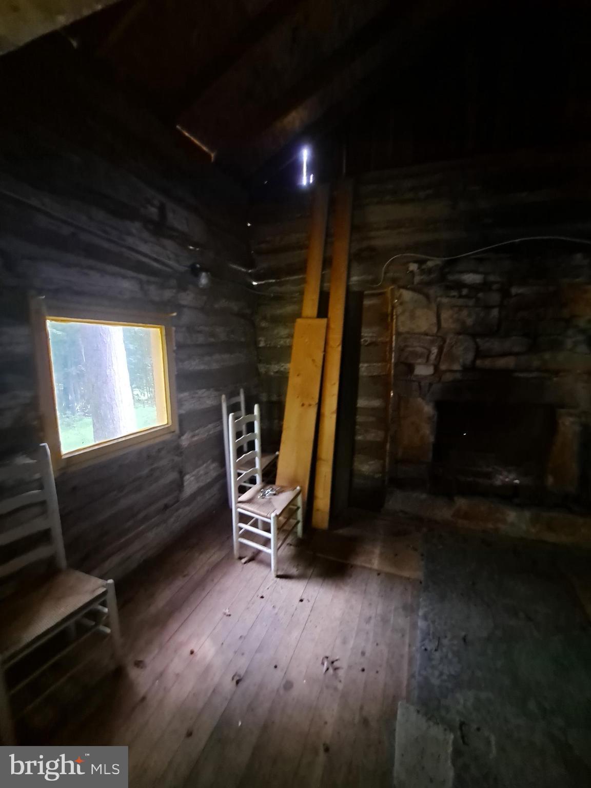 1079 Little Mountain Road Cabins, WV 26855 - Photo 35 of 50 a view of an empty room with wooden floor