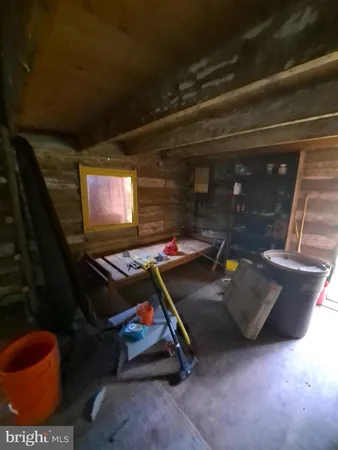 an aerial view of residential house with outdoor space and trees around