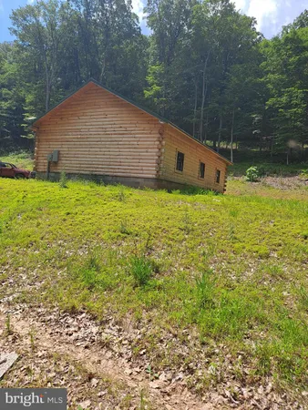 a backyard of a house with lots of green space
