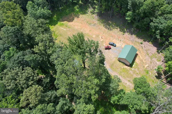 an aerial view of residential house with outdoor space and lake view