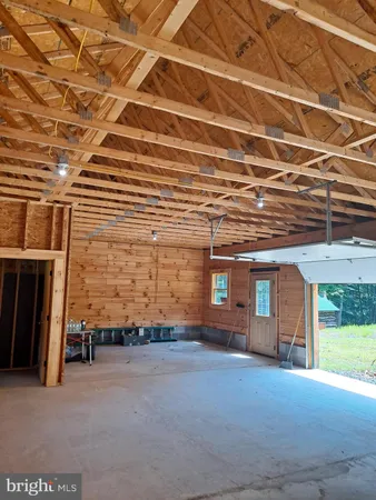 a view of an empty room with a fireplace
