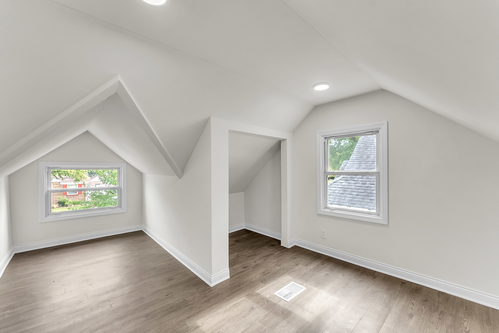 17908 Commercial Avenue Lansing, IL 60438 - Photo 16 of 35 an empty room with wooden floor and windows