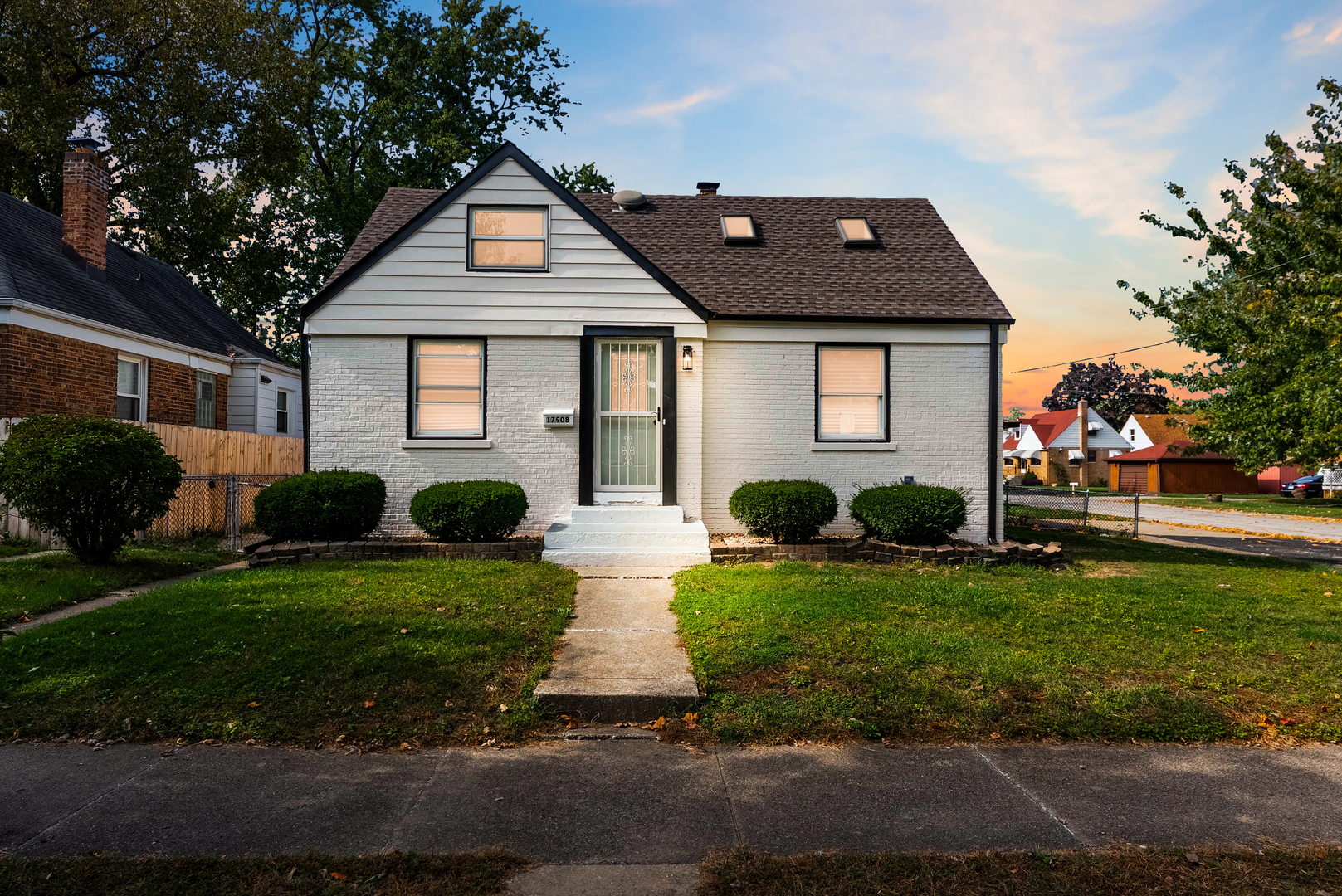 17908 Commercial Avenue Lansing, IL 60438 - Photo 2 of 35 a front view of a house with garden