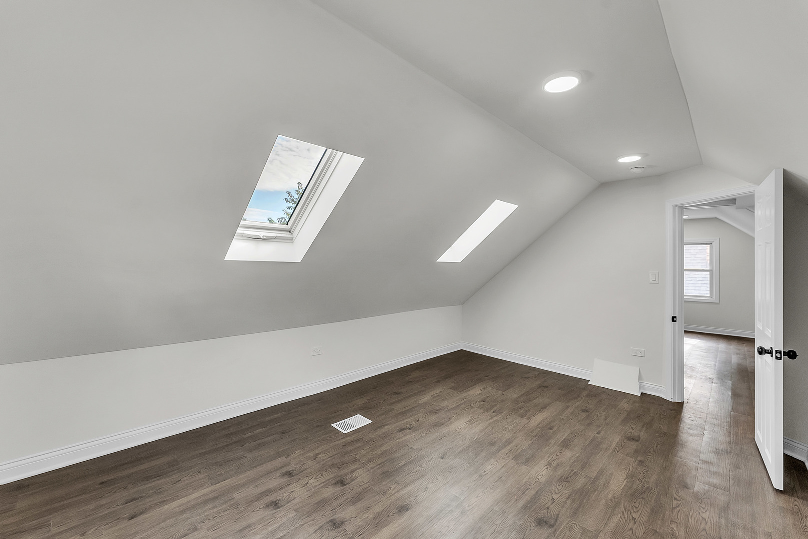 17908 Commercial Avenue Lansing, IL 60438 - Photo 21 of 35 an empty room with wooden floor and windows