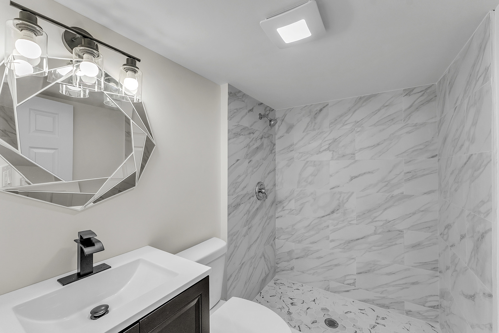 17908 Commercial Avenue Lansing, IL 60438 - Photo 23 of 35 a bathroom with a sink toilet and shower